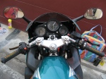 Riders' view showing polished triple and handlebars, new windscreen, grips, and mirrors